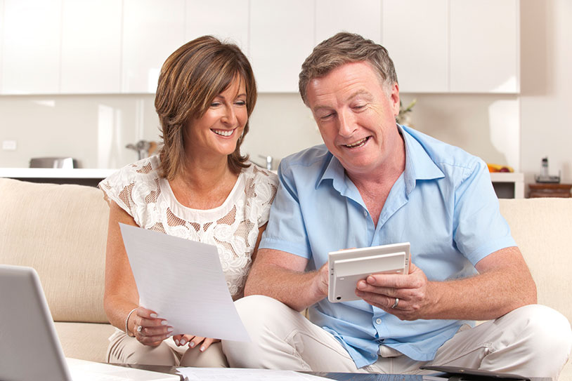 Couple looking at planning giving options. Links to What to Give Couple looking at planning giving options. Links to What to Give